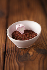 fine grated chocolate and heart marshmallow candy in  bowl  , wo