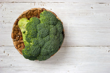 Broccoli in the basket on the white background