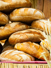many brown rustic fresh rye bread loaves
