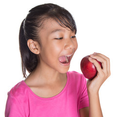 Young Asian Malay teenager with a red apple