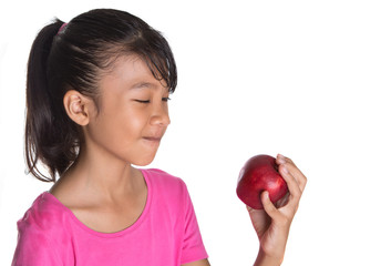 Young Asian Malay teenager with a red apple