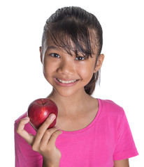 Young Asian Malay teenager with a red apple