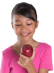 Young Asian Malay teenager with a red apple