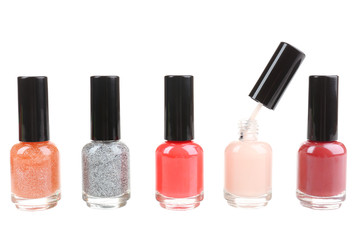 Colorful nail polishes isolated on white