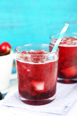 Closeup of cherry granita in glasses, on color wooden