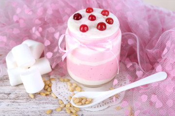 Obraz na płótnie Canvas Raspberry milk dessert in glass jar,