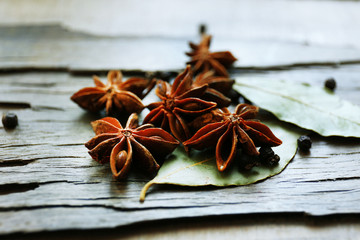 Star anise on dark wooden background, close-up