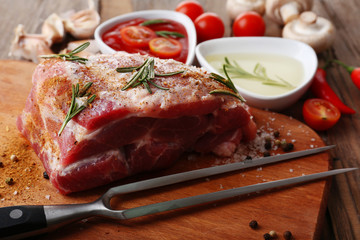 Raw meat on wooden table, close-up