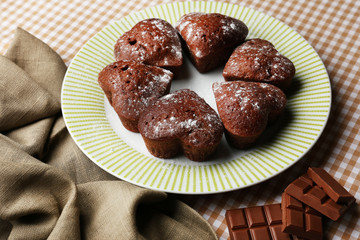 Homemade chocolate cupcakes on table