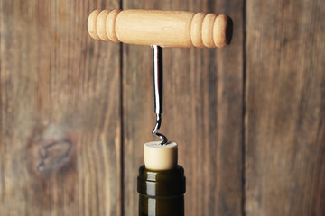 Fototapeta na wymiar Bottle opener close-up, on wooden background