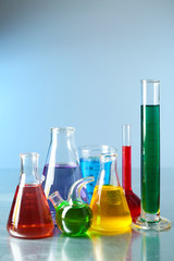 Different laboratory glassware with colorful liquid