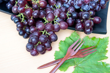 Grapes on a wooden tray