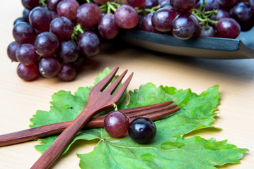Grapes on a wooden tray