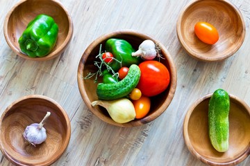 Fresh vegetables in wooden bowls
