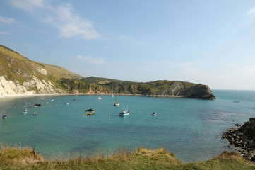 Boats moored in Lulworth Cove on Dorset coast