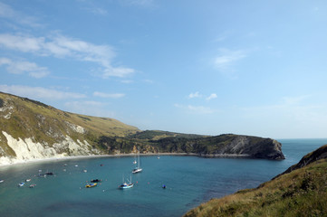 Boats moored in Lulworth Cove on Dorset coast