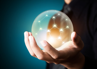 Business people holding social network in crystal ball