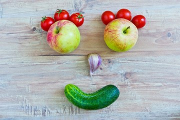 Funny smiling face. Conceptual image with vegetables
