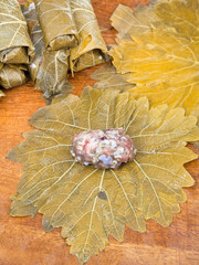 preparing of dolma from grape leaves, mince, rice