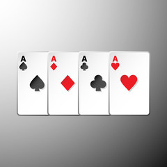 Four playing cards suits symbols on gray background