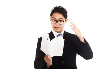 Excited Asian businessman read a book