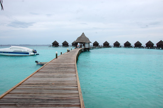 Timber pier and bungalow at Maldives