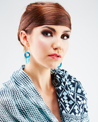 Fashion style young woman posing on isolated white background