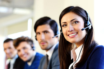Smiling businesspeople in a call center office