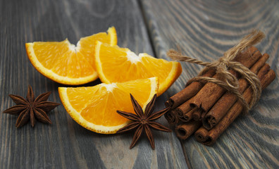 Orange with cinnamon sticks