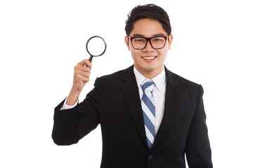 Fototapeta na wymiar Asian businessman with magnifying glass