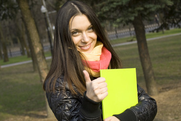 Student in the park with a folder