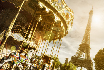 carousel and Eiffel Tower, Paris with sun flare