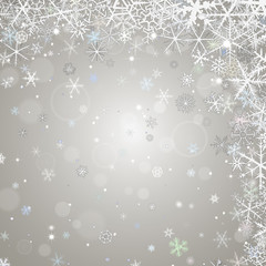 Abstract  winter ligth background with various snowflakes.