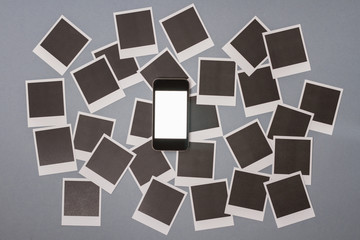 Smartphone with set of real blank instant photo