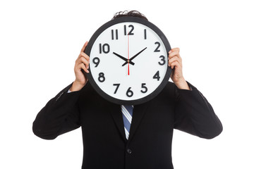 Asian businessman with a clock over face