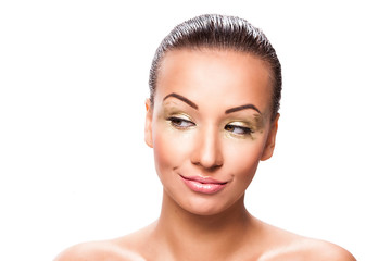 Beautiful young woman with gold makeup.