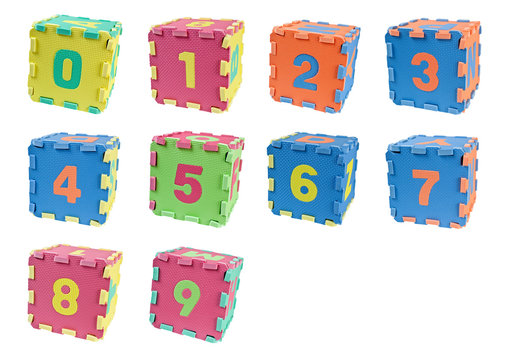 Toy cubes with the number zero to nine isolated on white