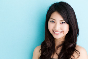 Fototapeta premium attractive asian woman beauty image on blue background