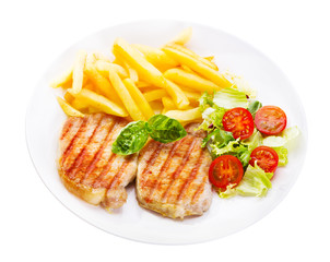 plate of grilled meat with vegetables