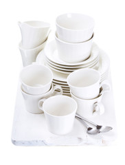 empty plates and cups on wooden board