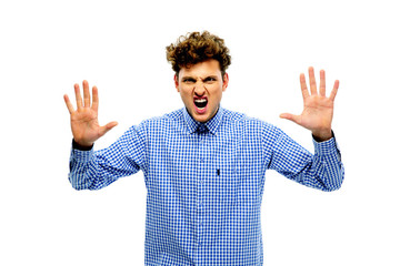 Portrait of angry young man with raising hands up