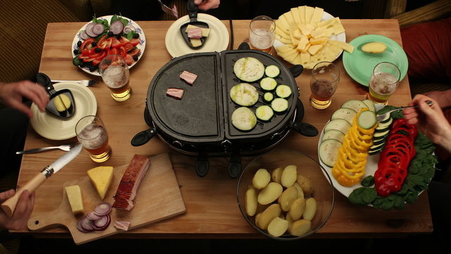 Friends eating grilled vegetable, drinking beer - time-lapse
