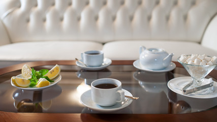 resting place, a white sofa and tea for two