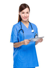 Female doctor use of tablet