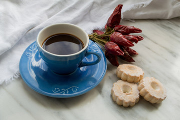 Espresso Coffee in a blue cup and italian Biscotti