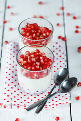 Jelly gelatin cream dessert or panna cotta with pomegranate seed