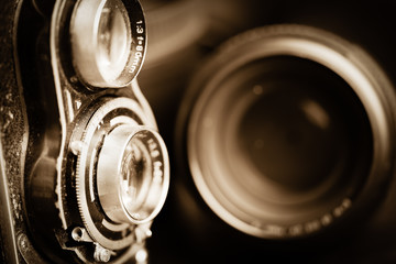 Vintage camera and lenses toned in sepia