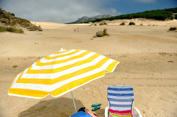 Umbrella on the dunes of Bolonia beach, Tarifa, Spain