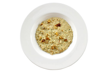 Bowl of oats porridge on a white background. Healthy breakfast