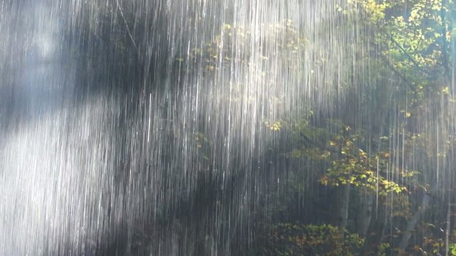 Behind the waterfall